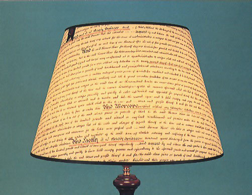 Indenture, on parchment 17" shade with black trim.  Available in different sizes.