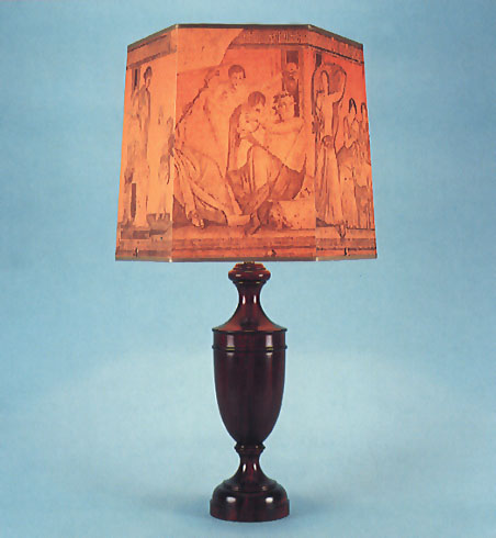 Large Ludwig, mahogany lamp base with 15" hexagonal parchment Pompeii shade with gold trim.