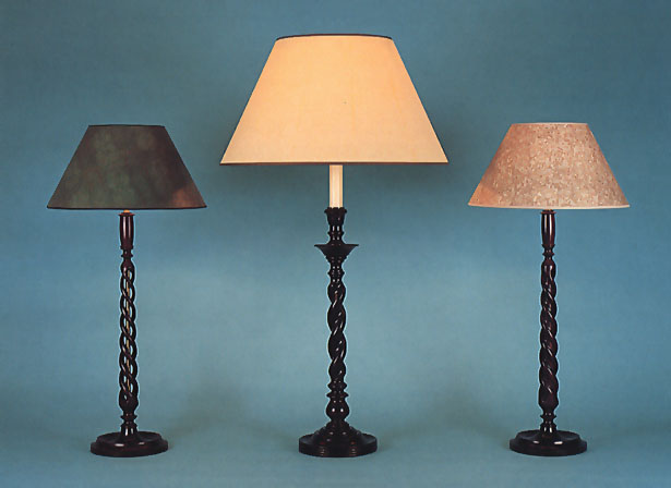 Open, Closed Bind and Carlos Mahogany, lamp bases with 14" faux skin and 17" antique parchment shades.