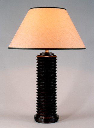 Matrix, lamp base mahogany, toffee parchment shade with black trim.