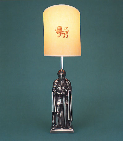 Pewter Knight, light lamp base with large half round lion on parchment shade with self coloured trim.