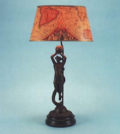 Phoebus, sun goddess bronzed lamp with 14" oval map shade with gold trim.