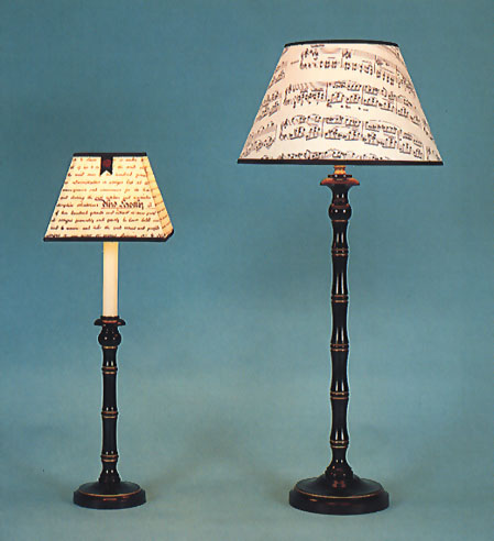 Small & Large Prinny, lamp base black and gold with shade and black trim.