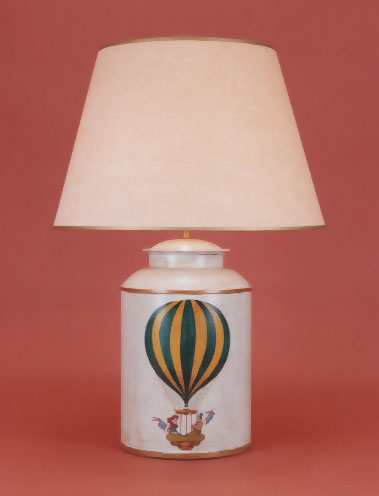 Green Balloon, tea canister lamp base on pale blue background with 17" antique parchment shade with gold trim.