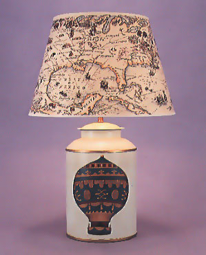 Montgolfier Balloon, tea canister lamp base on pale blue background with 17" Columbus shade with self coloured trim.