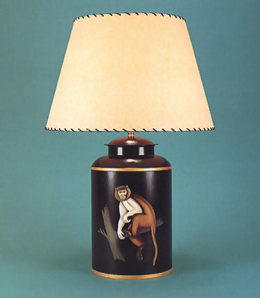 Monkey, hand painted tea canister lamp base on black background with 17" antique parchment shade with leather thonging.