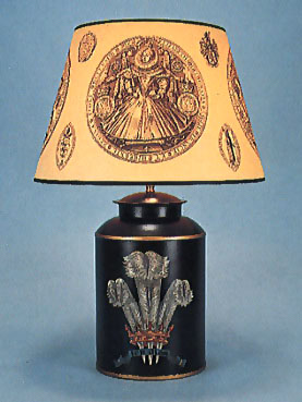 Prince of Wales feathers, lamp base on black background with 17" Elizabeth 1st shade with black trim.