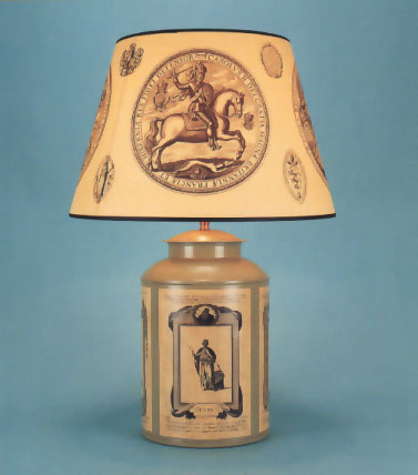 The Great Seal, Decoupage tea canister lamp base 18th Century prints of King's and Queen's of England on sage green background with 17" Elizabeth 1st parchment shade with black trim.